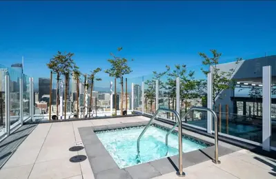 a swimming pool on the roof of a building at Elegant Luxury 1 Bedroom studio in Downtown LA in Vernon