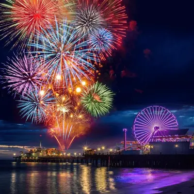 a fireworks display with a ferris wheel in the background at The Pearl Coast - Rooftop Pool, Gym Luxurious 2BR Santa Monica in Los Angeles