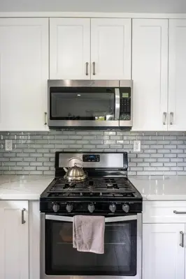 a kitchen with a stove and a microwave at Adorable 2BR-2BA House with EV & Free Parking and Family Friendly in Los Angeles in Los Angeles