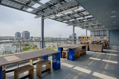 a large room with tables and chairs on a building at Spacious 2BD 2BA with Huge Balcony, Near Venice Beach & Fun! in Marina del Rey