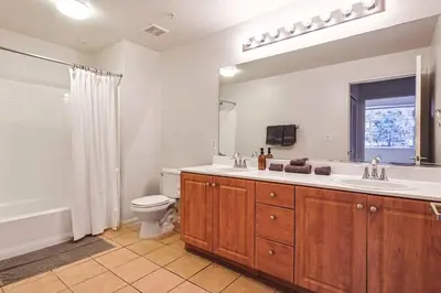 a bathroom with a sink and a toilet and a window at Well-Located 3BR Near SoFi Stadium & LAX in Los Angeles