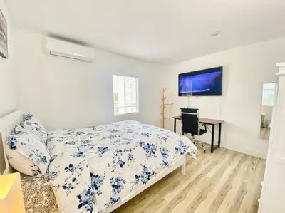 a bedroom with a bed and a desk in it at Sunset room only 1 guest near DTLA in San Gabriel