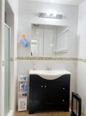 a bathroom with a sink and a mirror at Sunset room only 1 guest near DTLA in San Gabriel