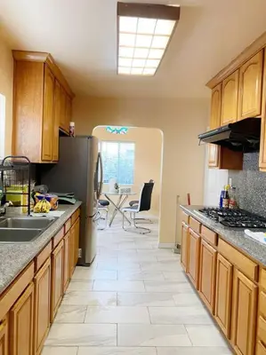 a kitchen with a sink and a refrigerator at Sunset room only 1 guest near DTLA in San Gabriel