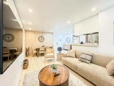a living room with a couch and a table at Boho-Chic 1BR-1BA Oasis near Hollywood -BRBEV13 in Los Angeles