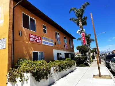 a building with a sign on the side of it at Lido Hotel in Huntington Park
