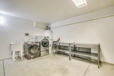 a laundry room with two washing machines in it at Family-Friendly Home with Fenced Yard in Victorville in Victorville