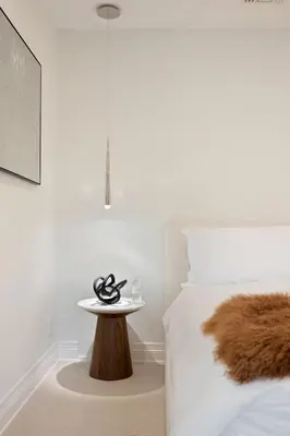 a white bedroom with a table next to a bed at Chateau Beverly Hills by Stay Awhile Villas in Los Angeles