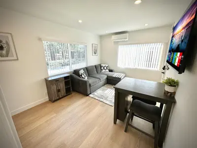 a living room with a couch and a table at RP415B - Inviting 1-Bedroom Haven in Captivating Burbank in Burbank