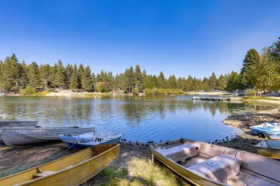 a group of boats sitting on the shore of a lake at Walk to Water Cozy Cabin in Green Valley Lake! in Green Valley Lake