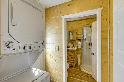 a bathroom with a toilet and a sink at Walk to Water Cozy Cabin in Green Valley Lake! in Green Valley Lake