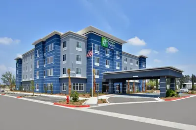 an image of a hotel with a building at Holiday Inn Express Hotels & Suites Loma Linda by IHG in Loma Linda