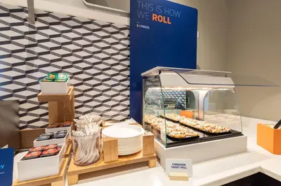 a display case with donuts and other pastries at Holiday Inn Express Hotels & Suites Loma Linda by IHG in Loma Linda