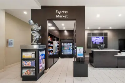 a store with a mouse statue in the middle of a store at Holiday Inn Express & Suites Anaheim Resort Area by IHG in Anaheim
