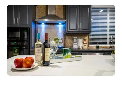 two bottles of wine and apples on a kitchen counter at LA Million dollar VIEW super spacious 5 bedroom home in Hacienda Heights