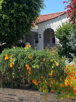 a garden of flowers in front of a house at Hancock weho in Los Angeles
