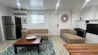 a living room with a couch and a table at Two Bedrooms Back House in Los Angeles in Los Angeles