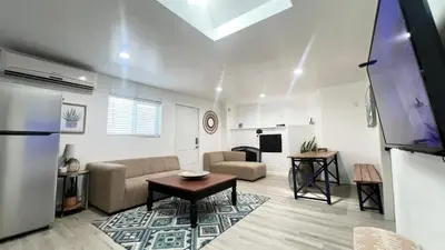 a living room with a couch and a table at Two Bedrooms Back House in Los Angeles in Los Angeles