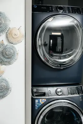 a microwave oven sitting next to a door at Hollywood Designer Apartment in Los Angeles
