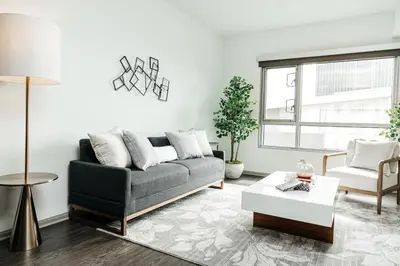 a living room with a couch and a table at Hollywood Designer Apartment in Los Angeles