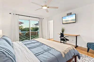 a bedroom with a bed and a ceiling fan at Luxury 4BD and 3BA in Topanga Oasis with Pool, Spa and Cabana in Glenview