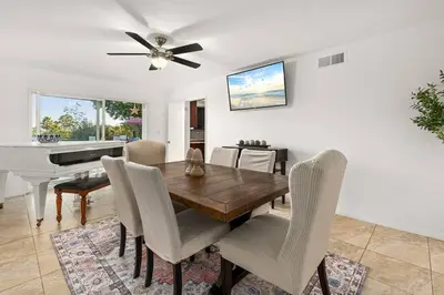 a dining room with a table and a piano at Luxury 4BD and 3BA in Topanga Oasis with Pool, Spa and Cabana in Glenview