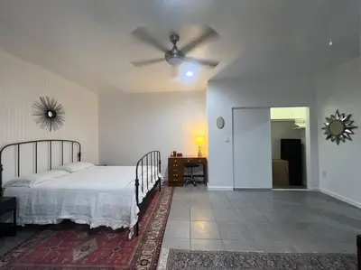 a bedroom with a bed and a ceiling fan at Great Private Studio in Noho in Los Angeles