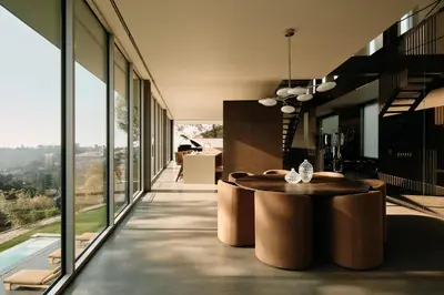 a large room with a table and large windows at Eterne by Stay Awhile Villas in Los Angeles