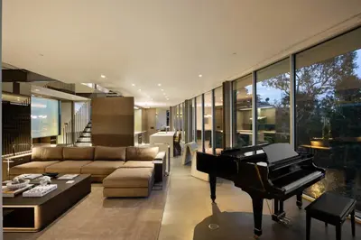 a living room with a piano and a couch at Eterne by Stay Awhile Villas in Los Angeles