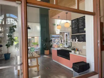 a restaurant with a counter in a room at Chambre de Bonne in Downtown Long Beach in Long Beach