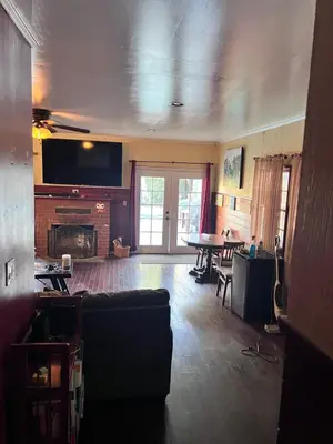 a living room with a couch and a table at Cozy Room In Downey in Downey