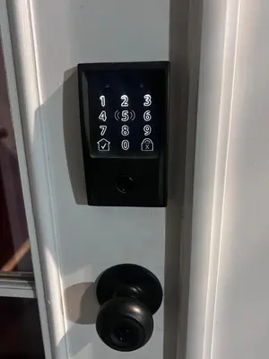 a door lock with a clock on a door at Cozy Room In Downey in Downey