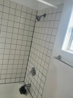 a shower with two faucets in a bathroom at Santa Monica Stays in Los Angeles
