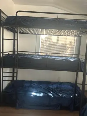 two bunk beds in a room with a window at Santa Monica Stays in Los Angeles