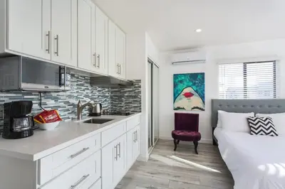 a kitchen with a sink and a couch in a room at Sunny Studio in the Heart of Venice Beach - #5 in Los Angeles