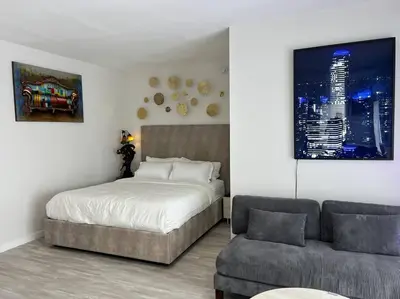 a bedroom with a bed and a couch at Marilyn Studio Apartment in Koreatown in Los Angeles