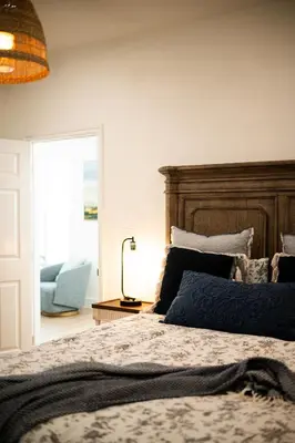 a bedroom with a bed with a wooden headboard at Cozy Retreat Near Downtown - Perfect for Families in Long Beach