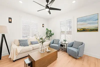 a living room with a couch and two chairs at Cozy Retreat Near Downtown - Perfect for Families in Long Beach