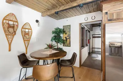 a dining room with a wooden table and chairs at Dream Catcher Retreat in Big Bear Lake