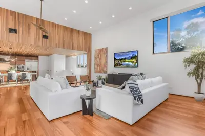 a living room with two white couches at Cedar Loft Villa in Los Angeles