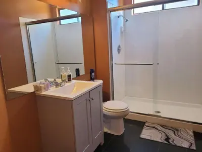 a bathroom with a sink and a toilet and a shower at 3BR & Loft near Palmdale Hospital in Palmdale