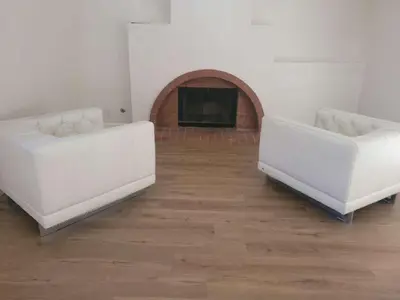 two white couches in a living room with a fireplace at 3BR & Loft near Palmdale Hospital- Shared Hm in Palmdale