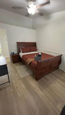 a bedroom with a large bed and a ceiling at 3BR & Loft near Palmdale Hospital- Shared Hm in Palmdale