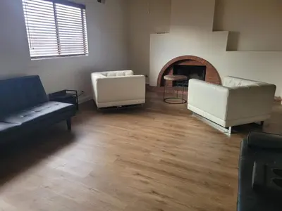 a living room with two couches and a fireplace at 3BR & Loft near Palmdale Hospital- Shared Hm in Palmdale