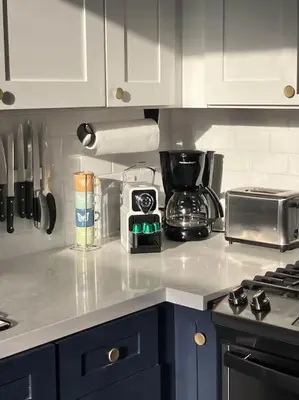 a kitchen with white cabinets and a counter top at Luxe Suite Convention Center Partial Ocean View with Free Parking in Long Beach
