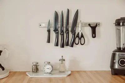 a bunch of knives hanging on a wall with a clock at Walk to Beach and Restaurants - Easy Parking in Long Beach