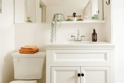 a white bathroom with a sink and a toilet at Walk to Beach and Restaurants - Easy Parking in Long Beach