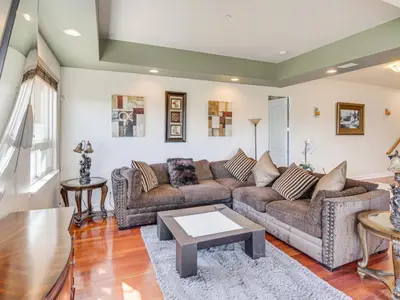 a living room with two couches and a table at 3BR Mountain Retreat with 2 Executive Suites & Scenic Views Sleeps 6 in Newbury Park