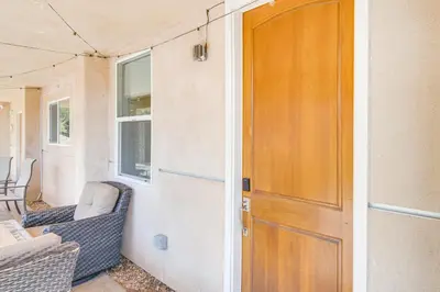 a door to an rv with a couch and a chair at The Surf Retreat in Newbury Park