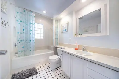 a white bathroom with a sink and a toilet and a tub at 22ppl Garage Parking Btw Disney Hollywood Monterey Park Chinatown in Monterey Park